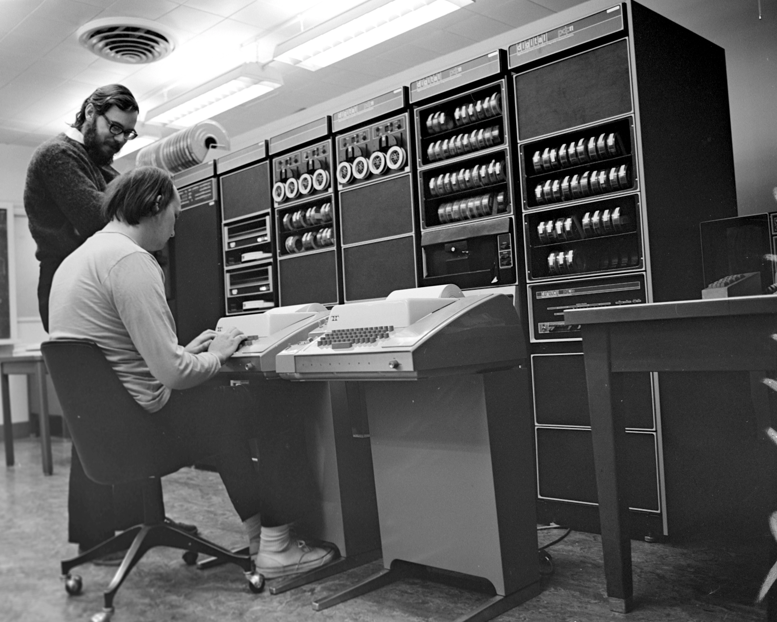 Ken_Thompson_(sitting)_and_Dennis_Ritchie_at_PDP-11_(2876612463).webp